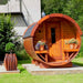 Traditional Sauna Barrel with flower pots with blooming plants.