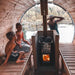 Family enjoying Sauna Barrel from Thermowood 1.9 x 2m next to a lake.