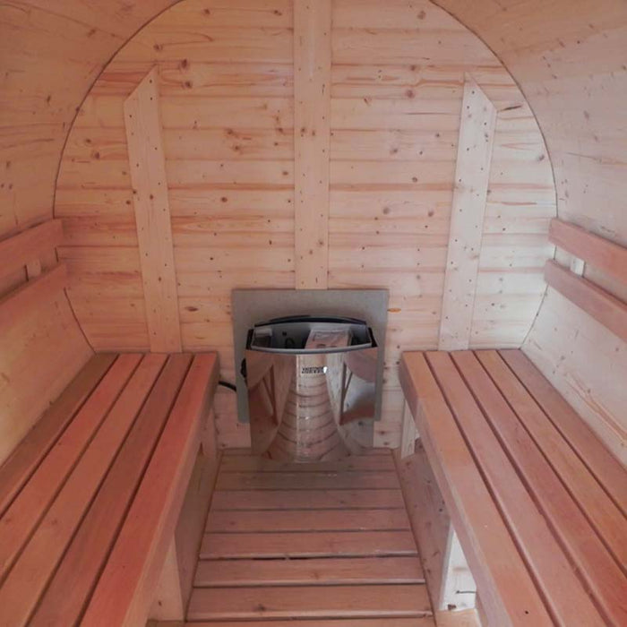 Inside view of a traditional barrel sauna featuring a modern electric heater and two parallel benches.