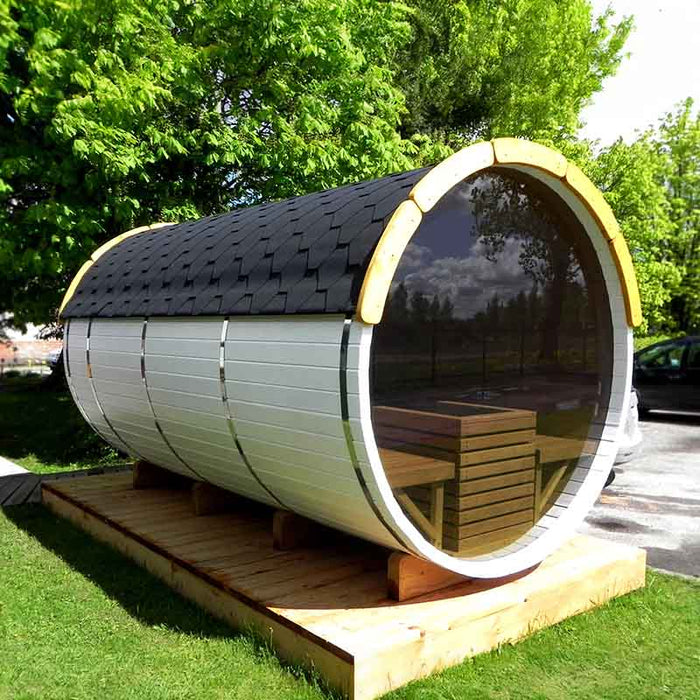 Traditional Sauna Barrel 1.9 x 3m with a wooden porch, glass door, and shingled roof, situated outdoors.