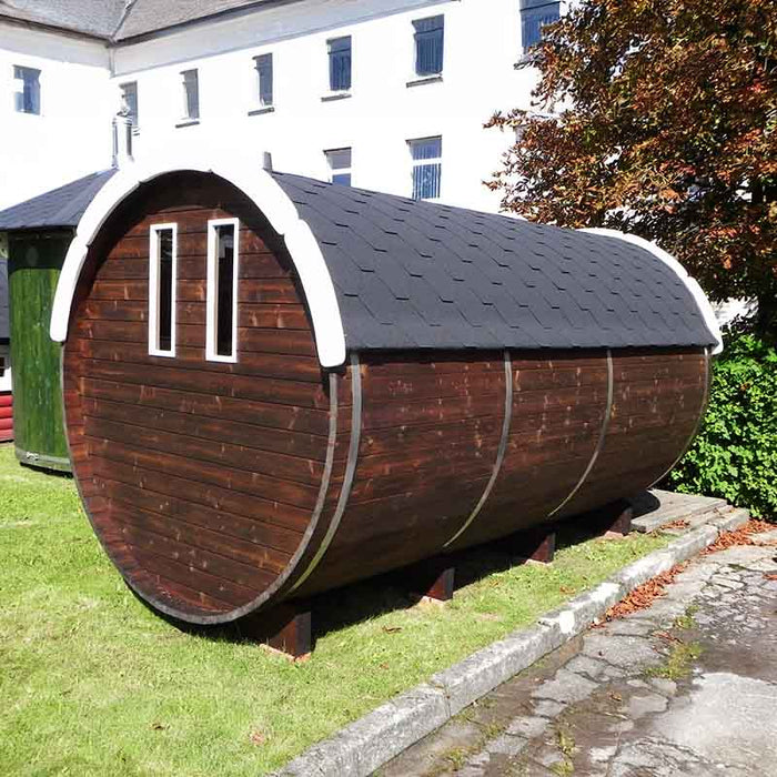 The Traditional Sauna Barrel 2.2 x 4m structure positioned on a concrete base. 