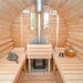 The interior of a Traditional Sauna Barrel 2.2 x 4m with wooden benches, a central heater, and sauna accessories.