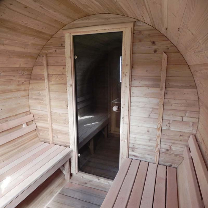  Interior of Traditional Sauna Barrel 2.2 x 4m a wooden structure with a curved, barrel-like ceiling.