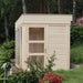 Front view of a traditonal sauna cube in a garden, with glass door and windows.