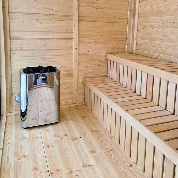 A cosy sauna room with a heater and a bench.