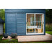 Traditional Sauna Cube 3 x 4m with Lounge in colour blue installed in the backyard.