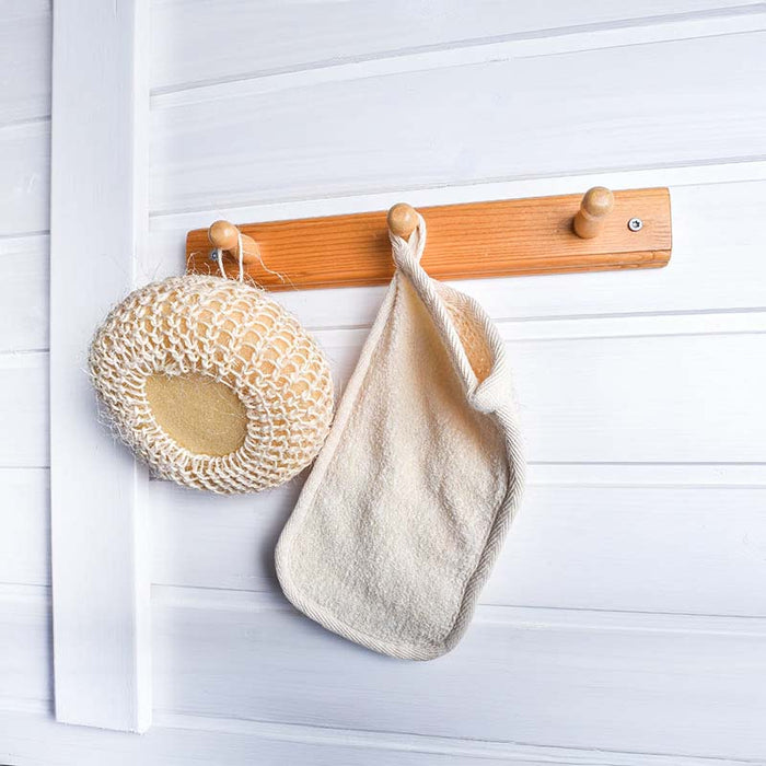 Close-up view of clothes hanger inside the Traditional Sauna Cube 3 x 4m with Lounge.