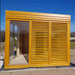 Side view of the Sauna Cube 3 x 4m in a garden. 