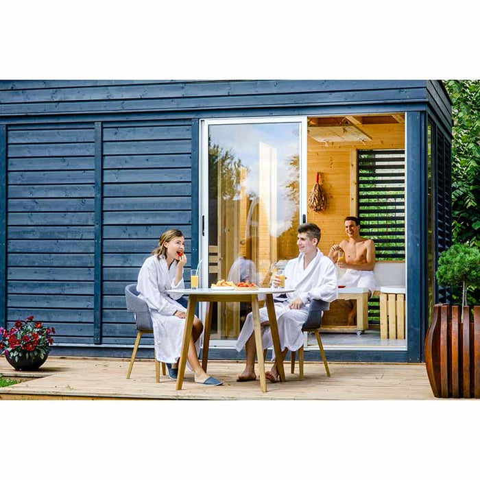 People enjoying the ambiance of Traditional Sauna Cube 3 x 4m with Lounge.