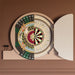 Half-open Vismara Argo Circus dartboard cabinet showing a vibrant peacock and classical motif on one door and a traditional dartboard on the other.