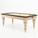 Studio image of the Vismara Arya air hockey table featuring beige and gold legs with a sleek modern design.
