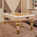 Elegant Vismara Arya air hockey table with gold playing surface and white lacquered finish, showcased in a luxury bar setting.