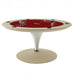 Round Vismara Asso poker table with rich red felt and beige body, featuring integrated cup holders and pedestal support.