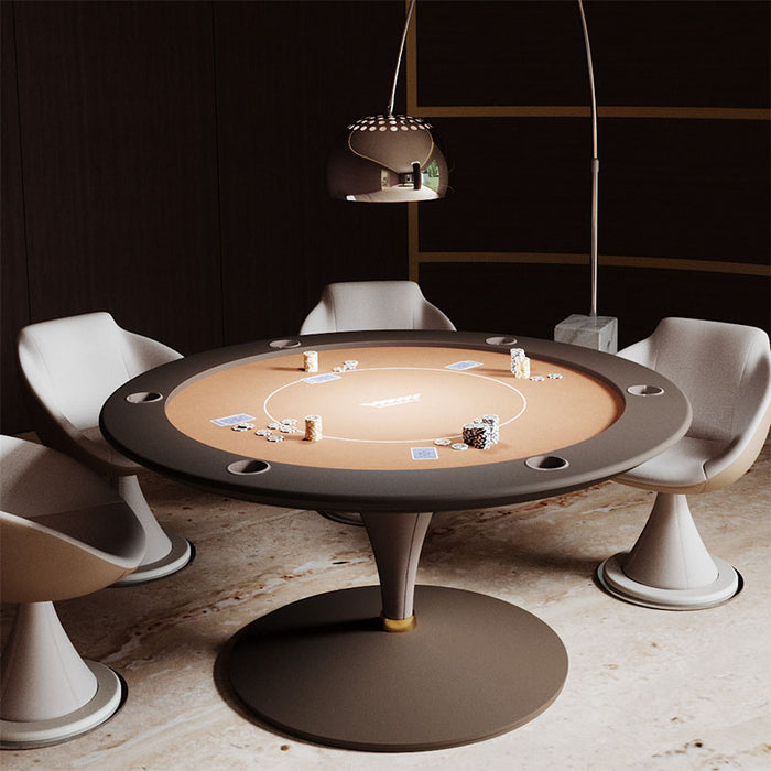 Round Vismara Asso poker table with tan felt and dark brown surround, styled with modern leather chairs and metallic floor lamp.