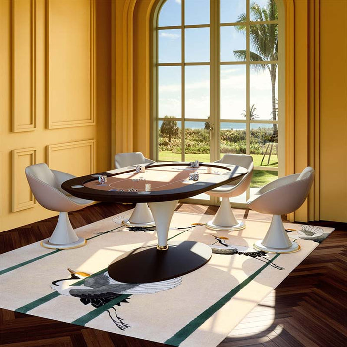 Vismara Asso oval poker table placed in a vibrant yellow room with panoramic garden view, complemented by modern swivel chairs.