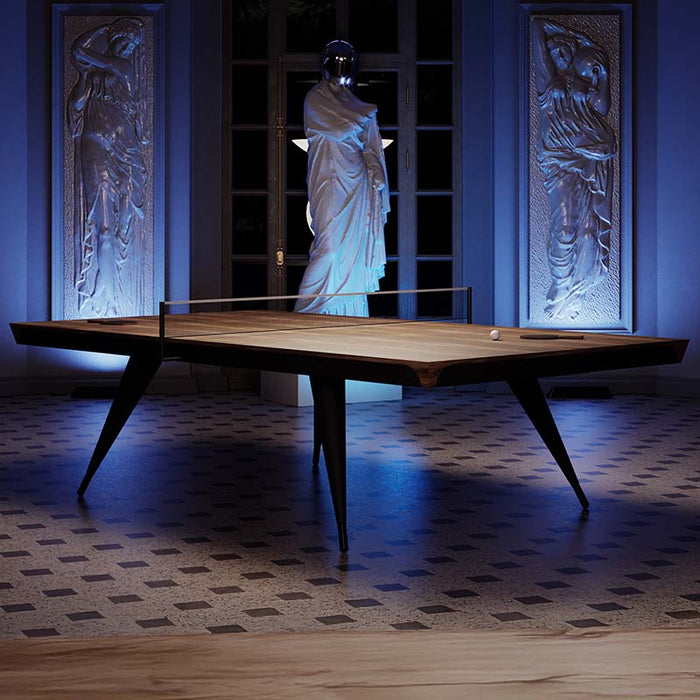 The Vismara Blade Table Tennis Table under dramatic lighting, creating a striking focal point in the room, with leather detailing and a high-quality wood veneer finish.