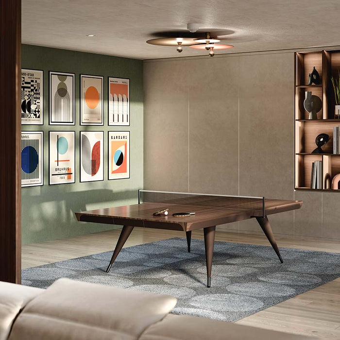 The Blade Table Tennis Table placed in a contemporary living room, blending seamlessly with modern décor, with its luxurious wood veneer top and leather detailing.