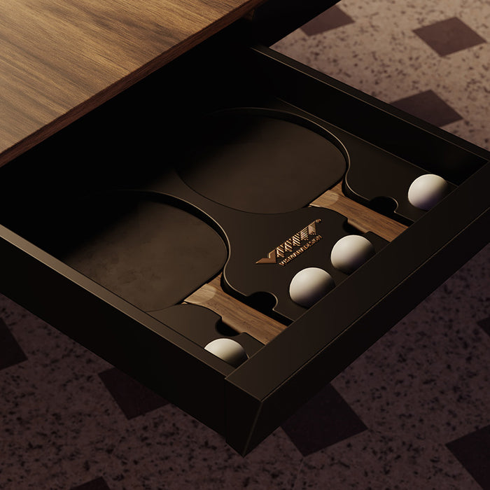 A close-up of the Vismara Blade Table Tennis Table’s hidden storage drawer, neatly holding rackets and balls, adding both practicality and elegance to the design.