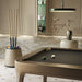 Vismara Bobo Cue Rack in neutral tones next to a beige-finished pool table with balls arranged for play in a designer home bar setting.
