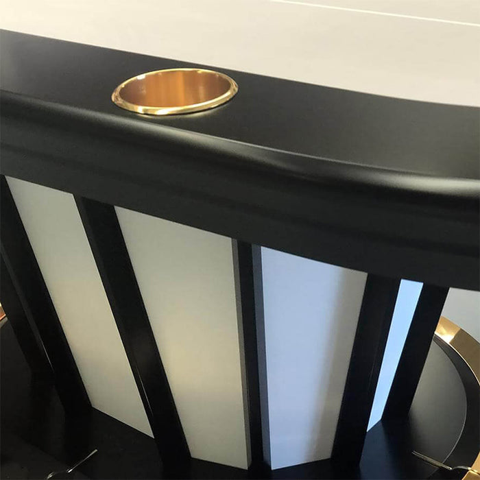 Close-up of the Vismara Desire Poker Table base showcasing gold-finished accents, black vertical supports, and sophisticated cream panelling.