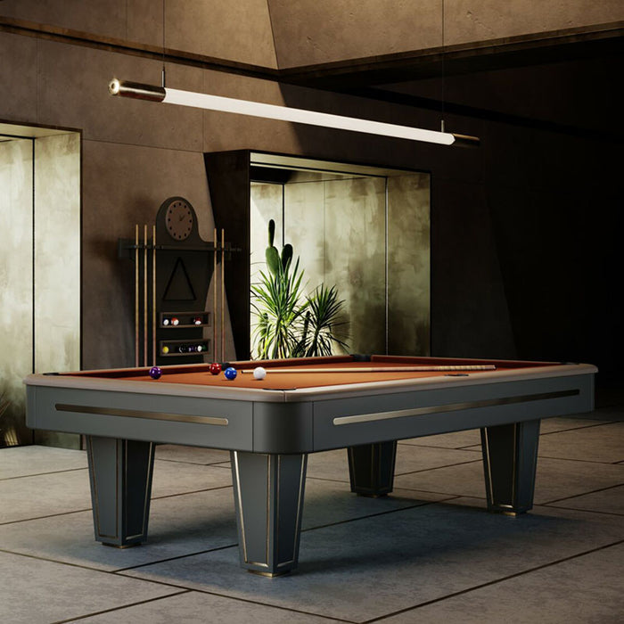 Rust-toned Vismara Desire pool table positioned in a minimal desert-view lounge, surrounded by cacti and concrete interior design elements.