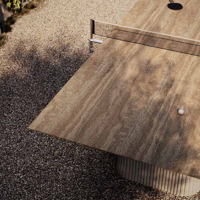 A top-down view showcasing the textured ceramic surface of the Vismara Egeo Table Tennis Table with its elegant Beige Travertino finish.