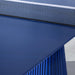 A detailed shot showcasing the table’s sleek blue surface and contemporary design.