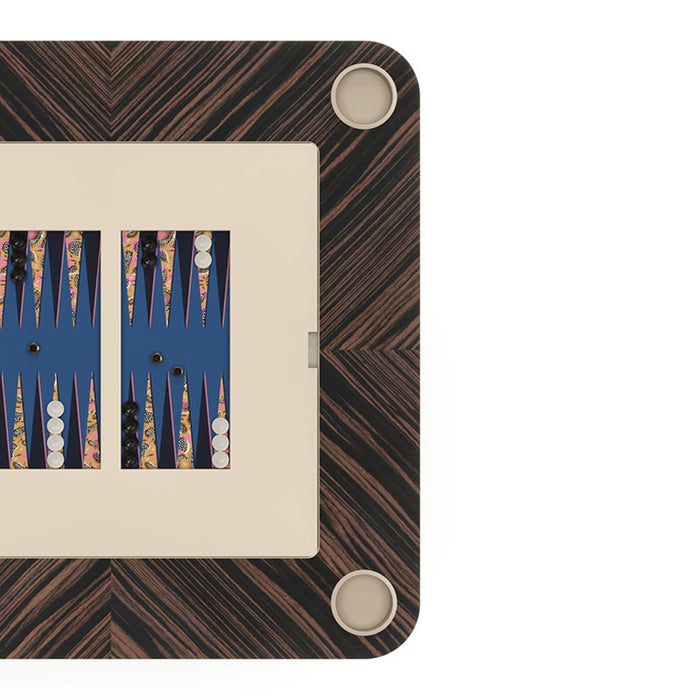 Vismara Enigma game table configured for backgammon with vibrant patterned triangles and a clean cream-blue board – luxury convertible gaming surface.