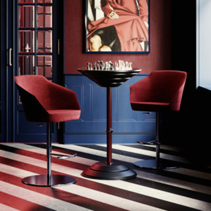 Vismara Goemon Chess Table set in an elegant library room with olive green armchairs, built-in bookshelves, and ambient pendant lighting – perfect for intellectual interiors.