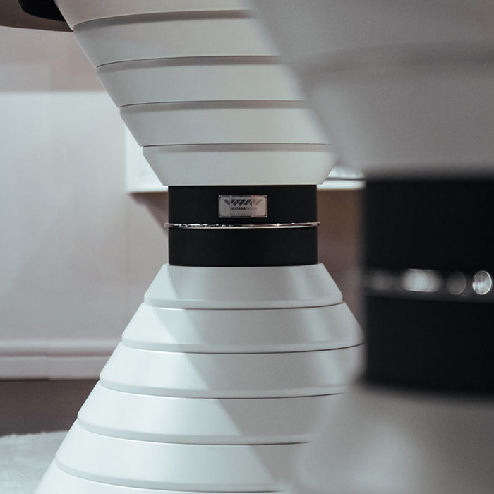 Close-up of the iconic conical base design of the Vismara Montecarlo Roulette Table in white lacquer finish – high-end craftsmanship and branding detail.