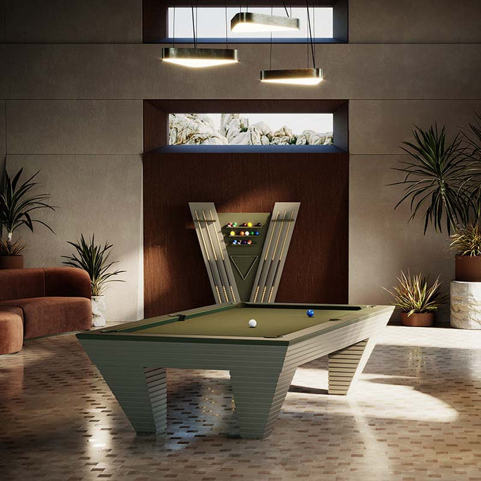 The Vismara Newde Pool Table positioned in a beautifully designed room with modern lighting and a matching cue rack.