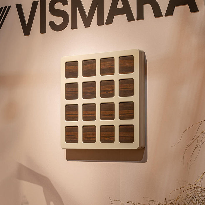 Closed Vismara Nido Dartboard Cabinet mounted on the wall with a cream and wood square panel grid design, blending seamlessly with modern interiors.