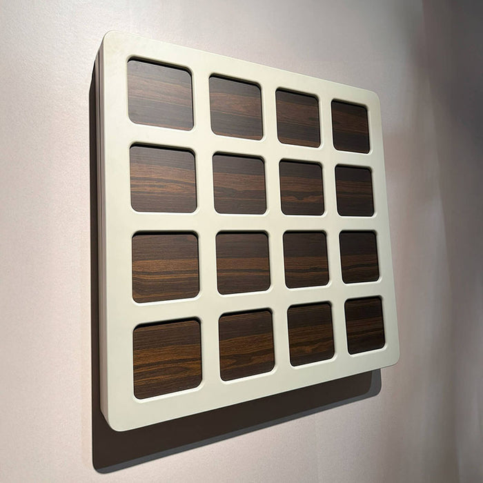 Vismara Nido Dartboard Cabinet closed and wall‑mounted, featuring a modern cream frame with integrated wood‑grain panels for a refined, minimalist game room look.