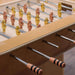 Close-up of Oskar Foosball Table handles and players, focusing on the precise craftsmanship and detailing.