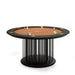 Isolated studio image of the Vismara Shanghai Poker Table with elegant round design, black radial base, terracotta felt top, and chips placed for a professional look.