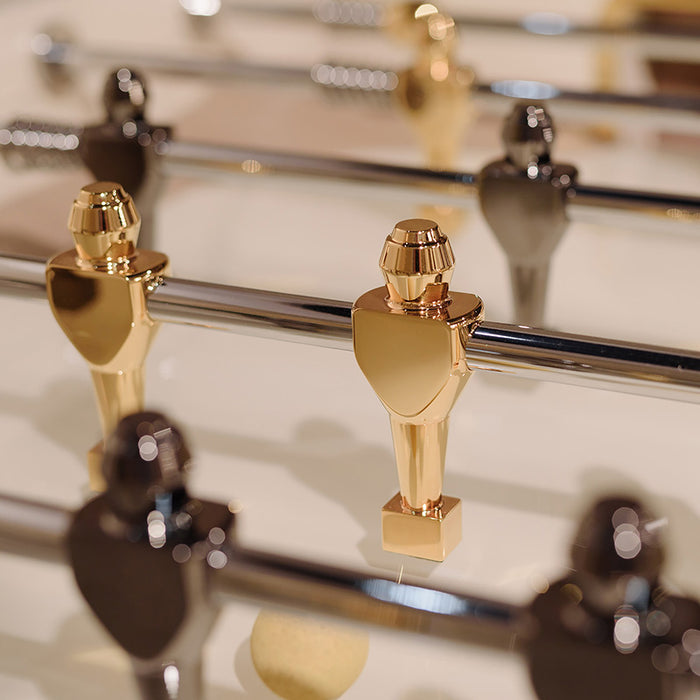 Detailed view of a gold foosball player on the Stadium Table, emphasising luxury and design precision.