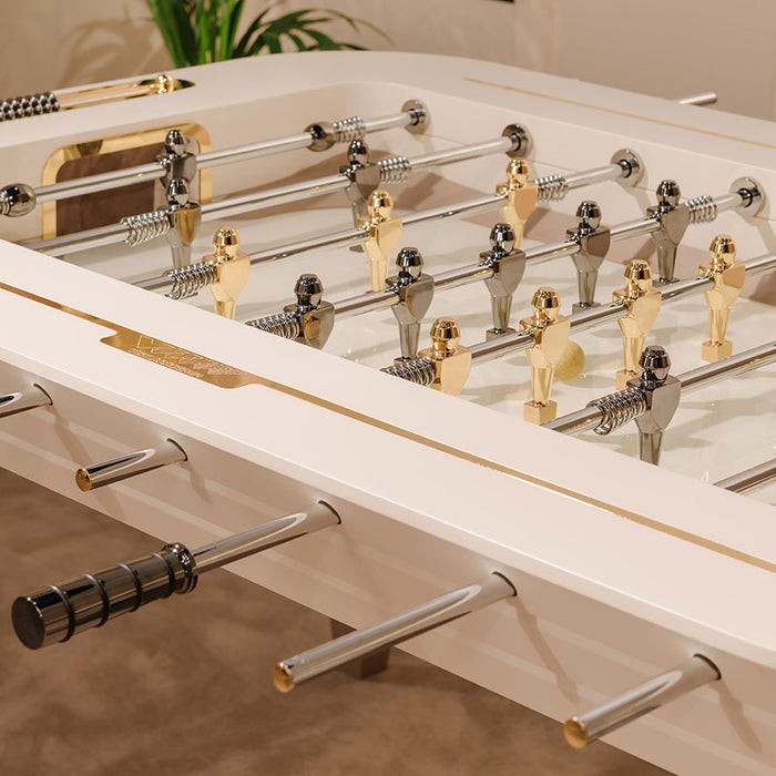 Closeup of the Vismara Stadium Foosball Table play area, focusing on player and rod design with metallic accents.