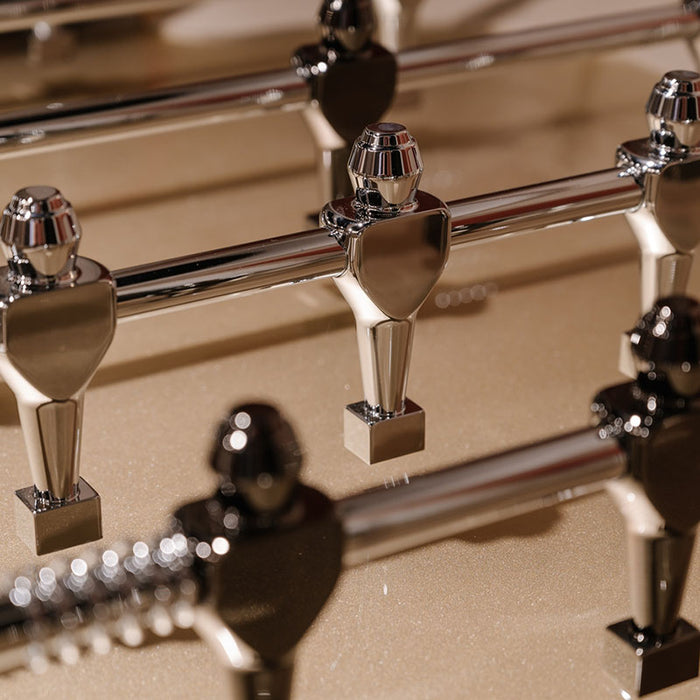 Close-up of chrome foosball players on the Stadium Foosball Table, showcasing luxury craftsmanship and polished detailing for a premium gaming experience.