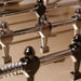 Close-up of chrome foosball players on the Stadium Foosball Table, showcasing luxury craftsmanship and polished detailing for a premium gaming experience.