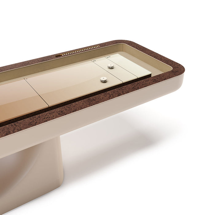 Close perspective of the Vismara Flume shuffleboard table showcasing rich brown border, sleek cream playing surface and elegant scoring beads – high‑end indoor entertainment furniture.