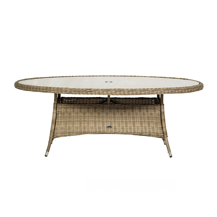 A direct front view of the Wentworth 6 Seater Ellipse Imperial Dining Set table, showcasing its spacious oval glass top and sturdy rattan base.