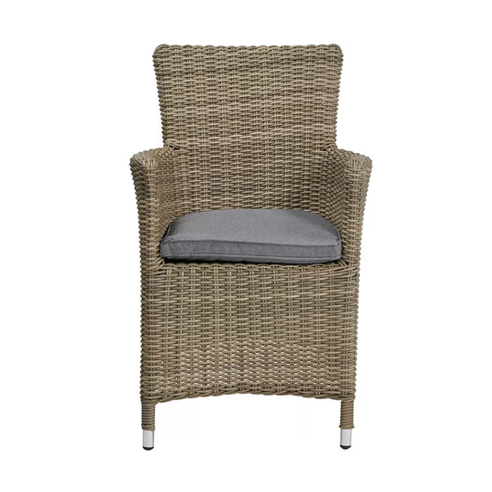 A direct front view of the chair from the Wentworth 6 Seater Round Carver Dining Set, highlighting its classic rattan construction and plush seating.