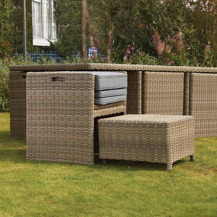 Wentworth 8 Seater Cube Dining Set partially tucked away, showing its space-saving design and garden-ready features.