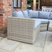 Cosy outdoor setup with the Wentworth Adjustable Corner Lounge Set, featuring grey cushions, wicker frame, and adjustable table.