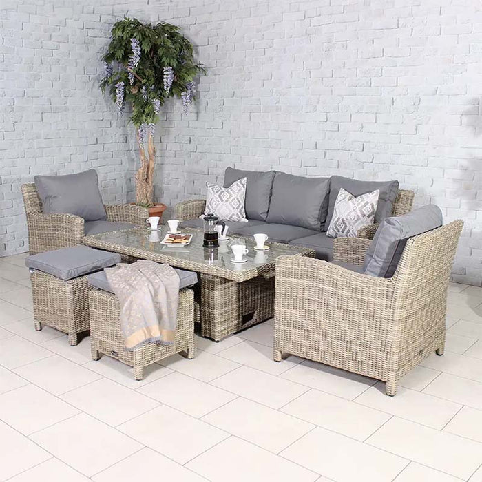 Stylish arrangement of the Wentworth Deluxe Sofa Dining Set, featuring rattan furniture with grey cushions, designed for comfortable outdoor gatherings.