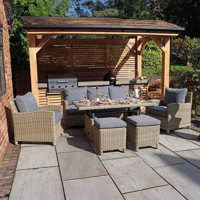 Wentworth Deluxe Sofa Dining Set displayed outdoors under a pergola, showcasing a stylish and functional dining arrangement.