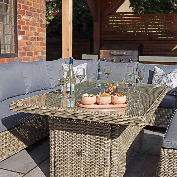 Wentworth Fire Pit Corner Dining & Lounge Set with Rectangular Table in a sunny garden, highlighting its elegant design and spacious seating.