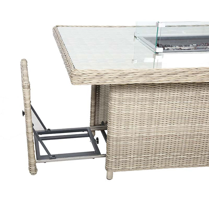 Close-up view of the Wentworth rectangular table with the fire pit mechanism extended, showcasing the practical and adjustable design.