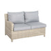 Side view of the Wentworth rattan sofa, showcasing its comfortable cushions and stylish wicker design.