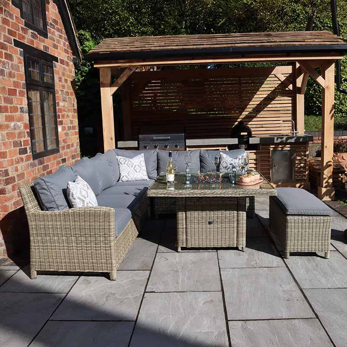 Stylish Wentworth Fire Pit Corner Dining Set with Square Table, showcasing its elegant rattan design and spacious seating area for cosy outdoor dining.